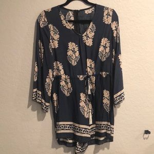 Blue romper with tan flowers